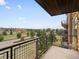Relaxing view from the balcony, showcasing the surrounding trees and neighborhood at 9019 E Panorama Cir # D320, Englewood, CO 80112