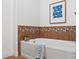 Bathroom showcasing the bathtub with tiled accents and a coordinating tiled floor at 9019 E Panorama Cir # D320, Englewood, CO 80112