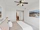 Cozy bedroom featuring soft, neutral tones and a view leading to a closet and bathroom at 9019 E Panorama Cir # D320, Englewood, CO 80112