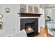 Close-up of a modern fireplace with a dark surround and decorative mantle accents at 9019 E Panorama Cir # D320, Englewood, CO 80112