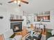 Inviting living space with fireplace, stylish furniture, and seamless flow to the kitchen and dining area at 9019 E Panorama Cir # D320, Englewood, CO 80112
