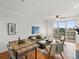 Bright living room with wood floors, modern furnishings, and sliding glass doors to balcony with views at 9019 E Panorama Cir # D320, Englewood, CO 80112