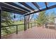 Back deck with dark pergola and a view of the backyard at 2330 Sandpiper Dr, Lafayette, CO 80026