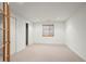 Bright bedroom with neutral carpet, a window with blinds, and closet doors at 2330 Sandpiper Dr, Lafayette, CO 80026
