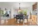 Open-concept dining room with hardwood flooring and a view into a living room at 2330 Sandpiper Dr, Lafayette, CO 80026