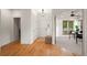 Entry foyer featuring hardwood floors, neutral walls, and views into adjacent room at 2330 Sandpiper Dr, Lafayette, CO 80026