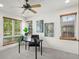 Bright home office with natural light from windows, neutral walls, and ceiling fan at 2330 Sandpiper Dr, Lafayette, CO 80026