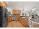 Stylish kitchen with stainless appliances, granite countertops, and easy access to the breakfast bar and living space at 2330 Sandpiper Dr, Lafayette, CO 80026