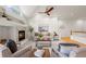 Bright living room with fireplace, vaulted ceiling, neutral decor and an open layout to the staircase at 2330 Sandpiper Dr, Lafayette, CO 80026