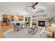 Living room view showcases the fireplace, open layout to kitchen, and bright natural light at 2330 Sandpiper Dr, Lafayette, CO 80026