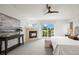 Bright main bedroom boasts a fireplace, deck access, and neutral decor at 2330 Sandpiper Dr, Lafayette, CO 80026