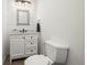 Bright powder room features a white vanity, framed mirror, and modern lighting fixture at 2330 Sandpiper Dr, Lafayette, CO 80026
