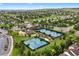 Aerial view of neighborhood park and tennis courts in a planned community at 9871 Indian Wells Dr, Lone Tree, CO 80124