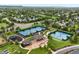 View of community tennis courts, playground, and covered picnic pavilion at 9871 Indian Wells Dr, Lone Tree, CO 80124
