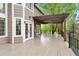 Expansive deck with pergola covering and ample space for outdoor dining and entertaining at 9871 Indian Wells Dr, Lone Tree, CO 80124