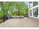 Elevated deck features a hot tub and scenic views of the property, perfect for relaxation at 9871 Indian Wells Dr, Lone Tree, CO 80124