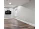 Finished basement with large flat screen TV and durable flooring and natural light at 9871 Indian Wells Dr, Lone Tree, CO 80124