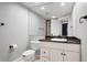 Bathroom featuring updated vanity and framed mirror, plus toilet and walk-in shower at 9871 Indian Wells Dr, Lone Tree, CO 80124