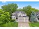 Charming two-story home with a three-car garage, brick accents, and a well-manicured lawn at 9871 Indian Wells Dr, Lone Tree, CO 80124