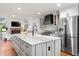 Modern kitchen with stainless steel appliances, granite countertops, and a kitchen island with storage at 9871 Indian Wells Dr, Lone Tree, CO 80124
