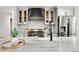 Contemporary kitchen with stainless steel appliances, custom cabinetry, and granite countertops at 9871 Indian Wells Dr, Lone Tree, CO 80124