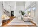 Bright and airy living room with high ceilings, hardwood floors, and large windows at 9871 Indian Wells Dr, Lone Tree, CO 80124