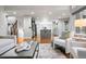 Open-concept living room featuring hardwood floors, recessed lighting, with a view into the kitchen at 9871 Indian Wells Dr, Lone Tree, CO 80124
