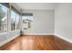 Bright living room features large windows, hardwood floors, and neutral paint at 9871 Indian Wells Dr, Lone Tree, CO 80124