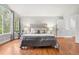 Bright bedroom with large windows, hardwood floors, and a comfortable neutral decor at 9871 Indian Wells Dr, Lone Tree, CO 80124