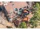 Aerial view of multi-story home, featuring decks, and skylights nestled among trees at 23785 Currant Dr, Golden, CO 80401