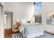 Bedroom with a view, hardwood floors, and plenty of natural light at 23785 Currant Dr, Golden, CO 80401