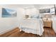 Serene bedroom with soft lighting, hardwood floors, and mountain view artwork at 23785 Currant Dr, Golden, CO 80401