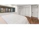 Bright bedroom featuring hardwood floors, closet and door at 23785 Currant Dr, Golden, CO 80401