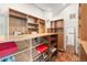 Spacious walk-in closet with custom shelving and hardwood floors at 23785 Currant Dr, Golden, CO 80401