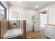 Practical dog wash station with tiled surround and a handheld showerhead at 23785 Currant Dr, Golden, CO 80401