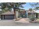 Charming home exterior with stone pathway and mature landscaping featuring a beautiful tree at 23785 Currant Dr, Golden, CO 80401
