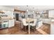 Bright kitchen features staircase access, granite counters and stainless appliances at 23785 Currant Dr, Golden, CO 80401