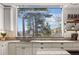Bright kitchen with a sink under a large window with a mountain view at 23785 Currant Dr, Golden, CO 80401
