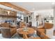 Spacious living room showcases stone fireplace and a wood beam ceiling at 23785 Currant Dr, Golden, CO 80401
