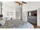 Bedroom featuring hardwood floors, a vaulted ceiling, a TV, and a door at 23785 Currant Dr, Golden, CO 80401