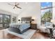 Main bedroom featuring a vaulted ceiling, hardwood floors, and natural light from many windows at 23785 Currant Dr, Golden, CO 80401