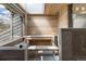 Bright home sauna with glass enclosure and wooden benches at 23785 Currant Dr, Golden, CO 80401
