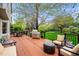 The back deck boasts a stainless steel grill, an outdoor dining area, and a seating area with an expansive lawn view at 7954 S Franklin Ct, Centennial, CO 80122