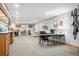 Spacious basement area with office space, a sofa and wall mounted bike rack at 7954 S Franklin Ct, Centennial, CO 80122
