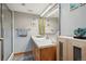 Bathroom featuring a vanity with drawers, a sink and a walk-in shower at 7954 S Franklin Ct, Centennial, CO 80122