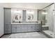 Elegant bathroom with double sinks, gray cabinetry, and a glass-enclosed shower with stylish tile work at 7954 S Franklin Ct, Centennial, CO 80122