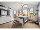 Bright bedroom with multiple windows, sleek furniture, and modern decor at 7954 S Franklin Ct, Centennial, CO 80122