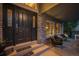 Inviting front porch boasts brick accents, a cozy seating area, decorative front door and a 'thankful to be together' door mat at 7954 S Franklin Ct, Centennial, CO 80122