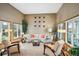 Inviting living room with neutral tones, comfortable armchairs, sofa, and a view of the landscaped backyard at 7954 S Franklin Ct, Centennial, CO 80122