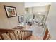 Open-concept living room featuring a fireplace, soaring ceilings, and natural light from large windows at 7954 S Franklin Ct, Centennial, CO 80122